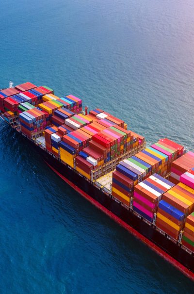 Aerial view of container cargo ship in sea.